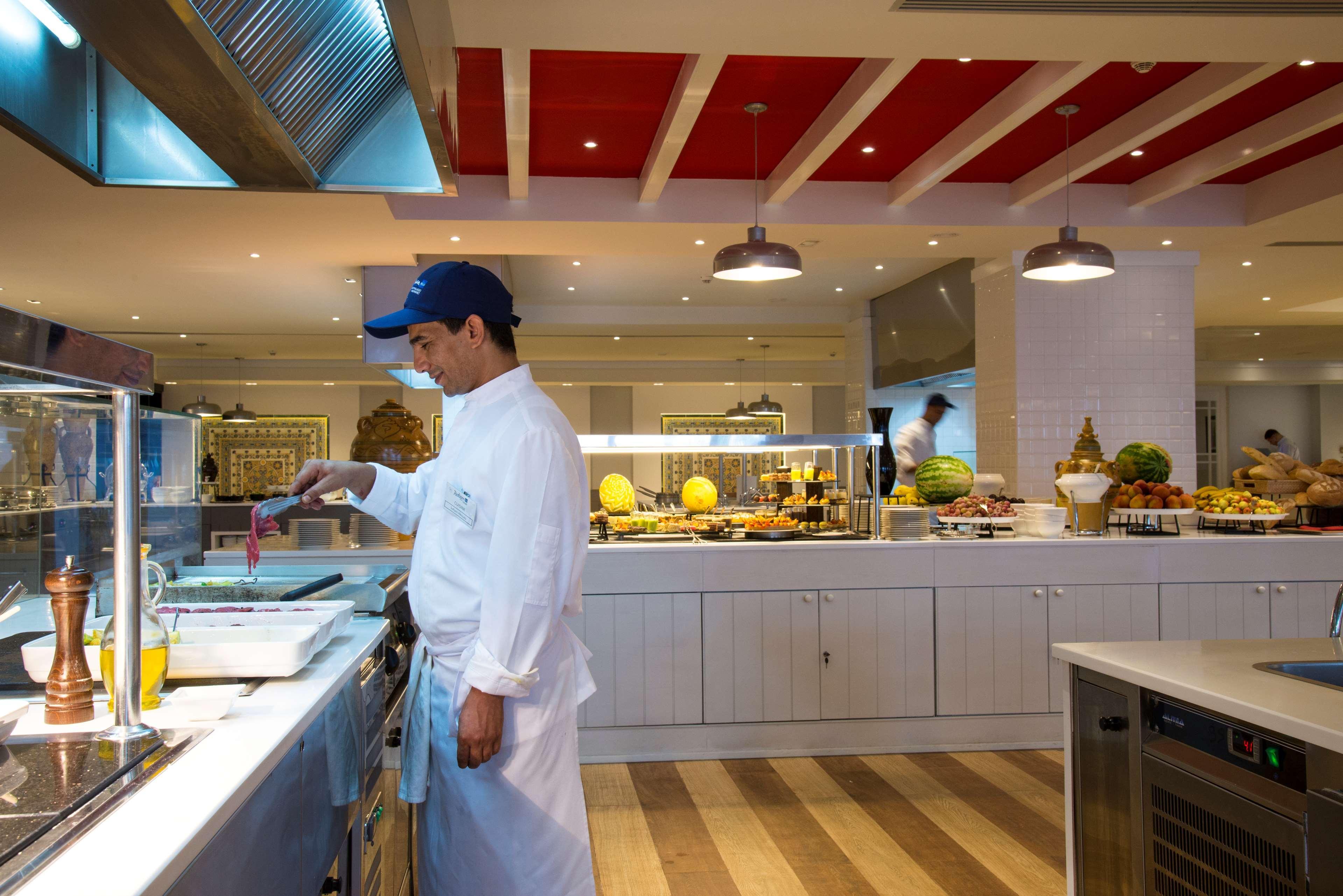 Radisson Blu Resort & Thalasso Hammamet Exterior photo A cook working in a hotel kitchen